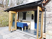 River Cabin with the doors wide open